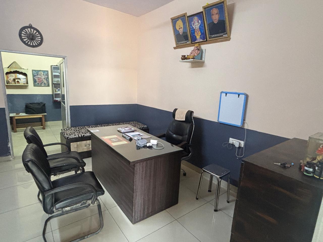 Doctor's desk with ancestral portraits on the wall