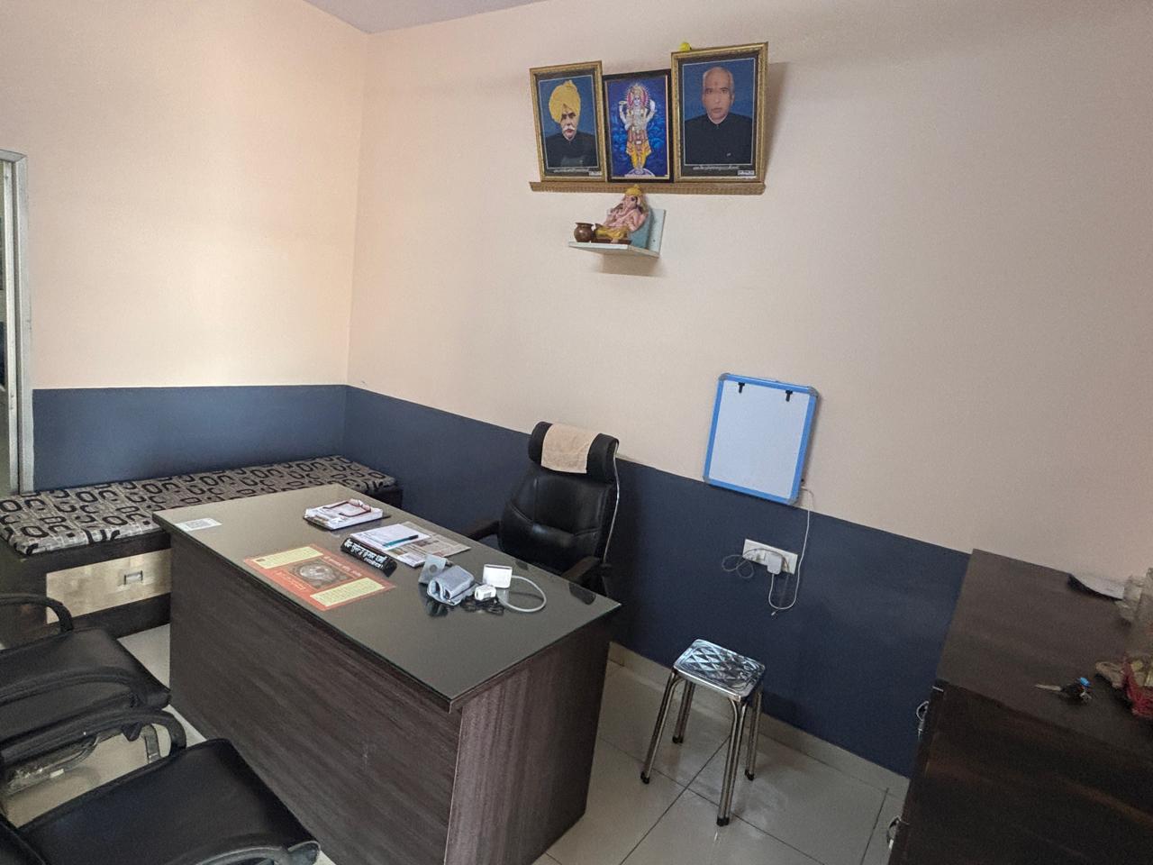 Consultation desk with ancestral blessings above